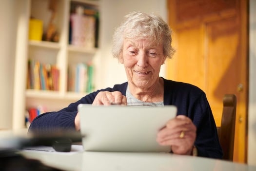 old woman looking at ipad