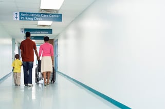 walking down hospital hallway