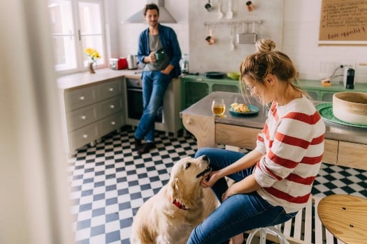 relaxing in kitchen with dog