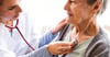 Clinician with stethoscope listening to member