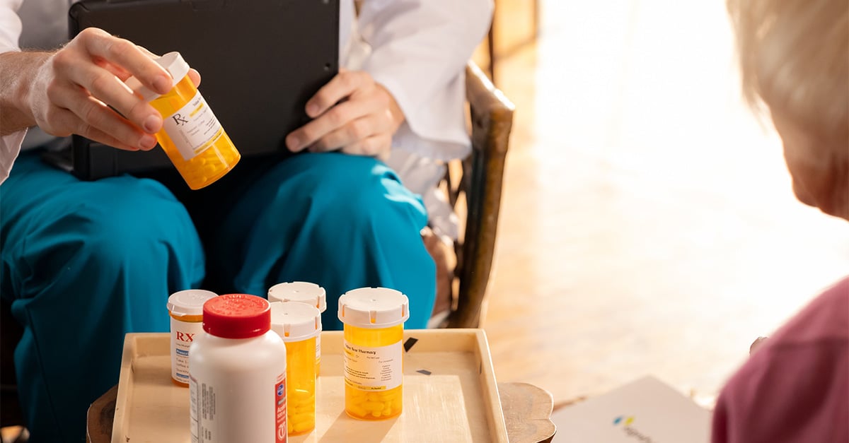 Clinician reviewing prescriptions with member. 