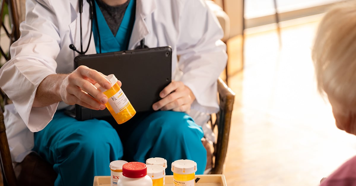 Clinician and member looking over prescriptions