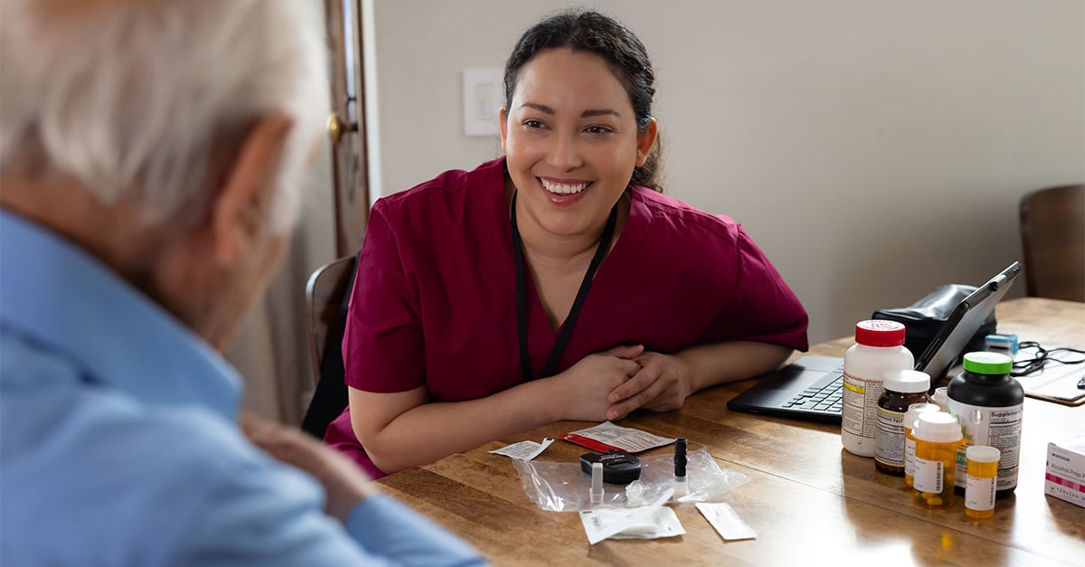 Clinician and member at home table