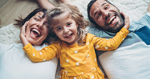 family laying down laughing