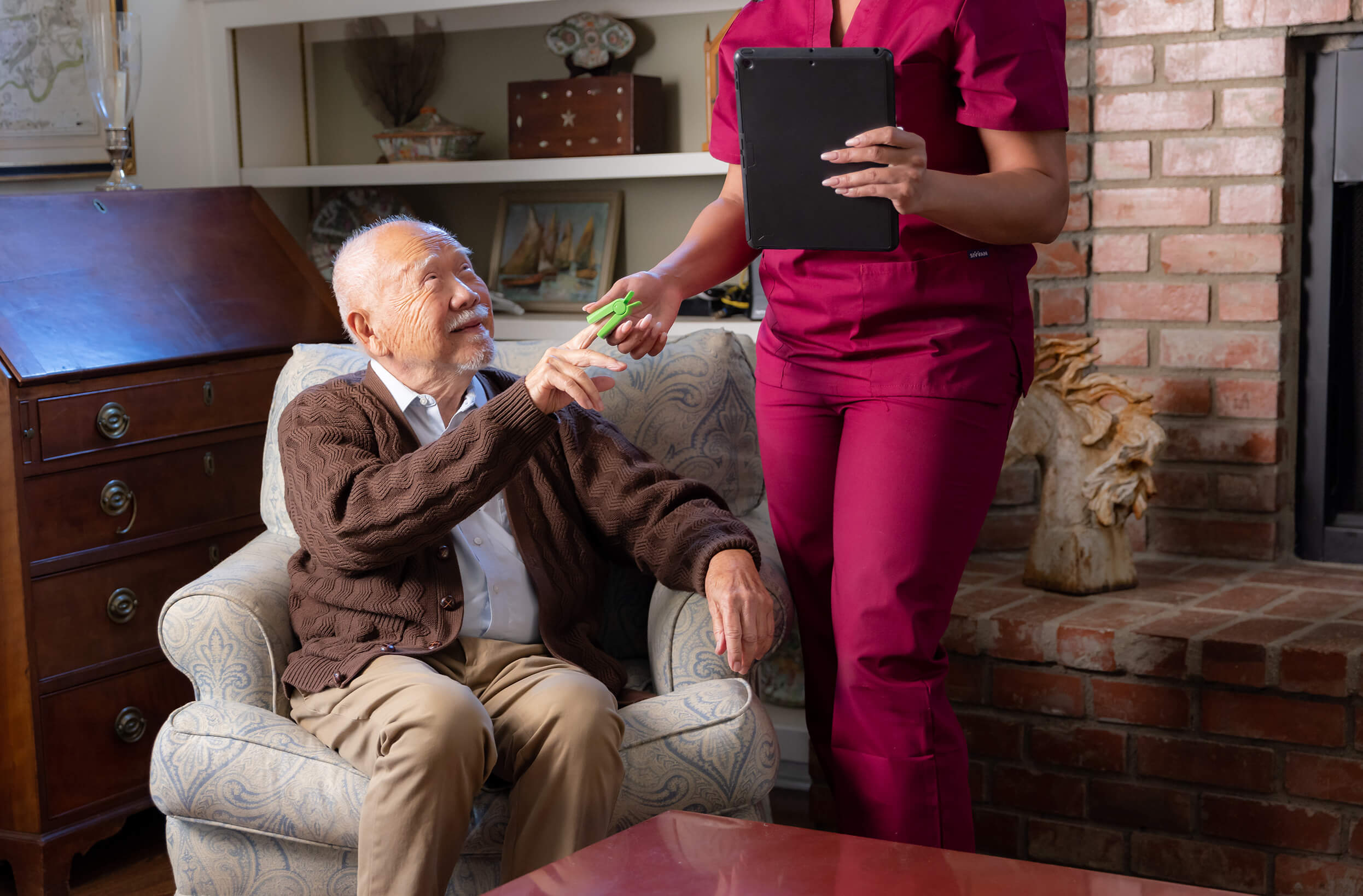 A Signify Health clinician visits a health plan member in his home